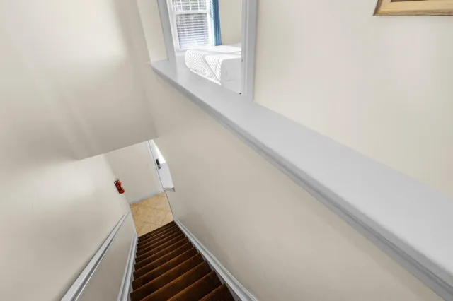 a bedroom with a balcony and a bed