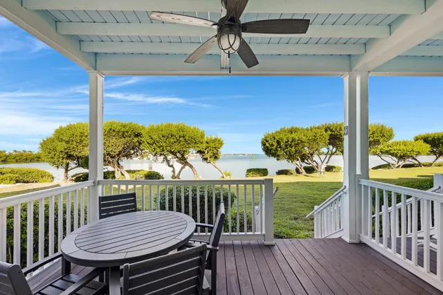 a view of a balcony with wooden floor