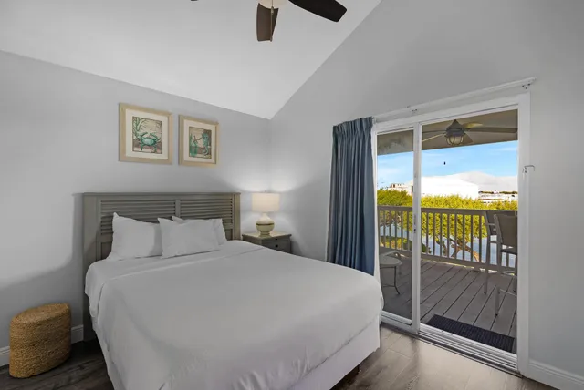 a bathroom with a granite countertop shower sink vanity and mirror
