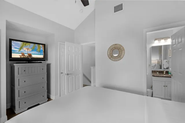 a bathroom with a toilet and a window