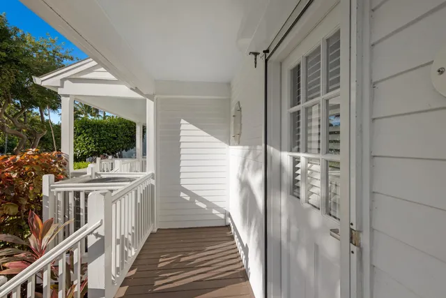 a kitchen with white cabinets sink and stainless steel appliances