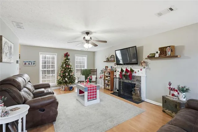 a living room with furniture and a flat screen tv
