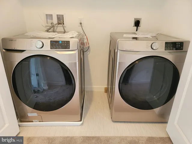 a kitchen with stainless steel appliances and wooden cabinets