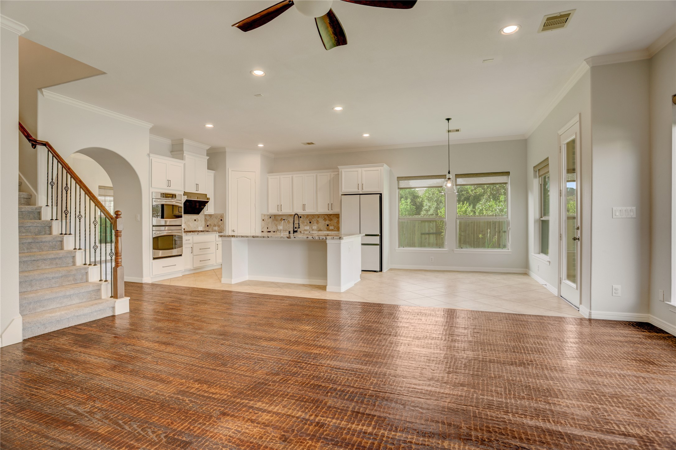 3002 Currant Drive Manvel, TX 77578 - Photo 17 of 43 a view of kitchen with wooden floor and window