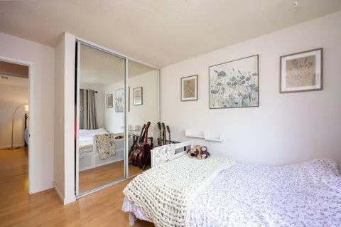 a bedroom with a bed and a view of bathroom