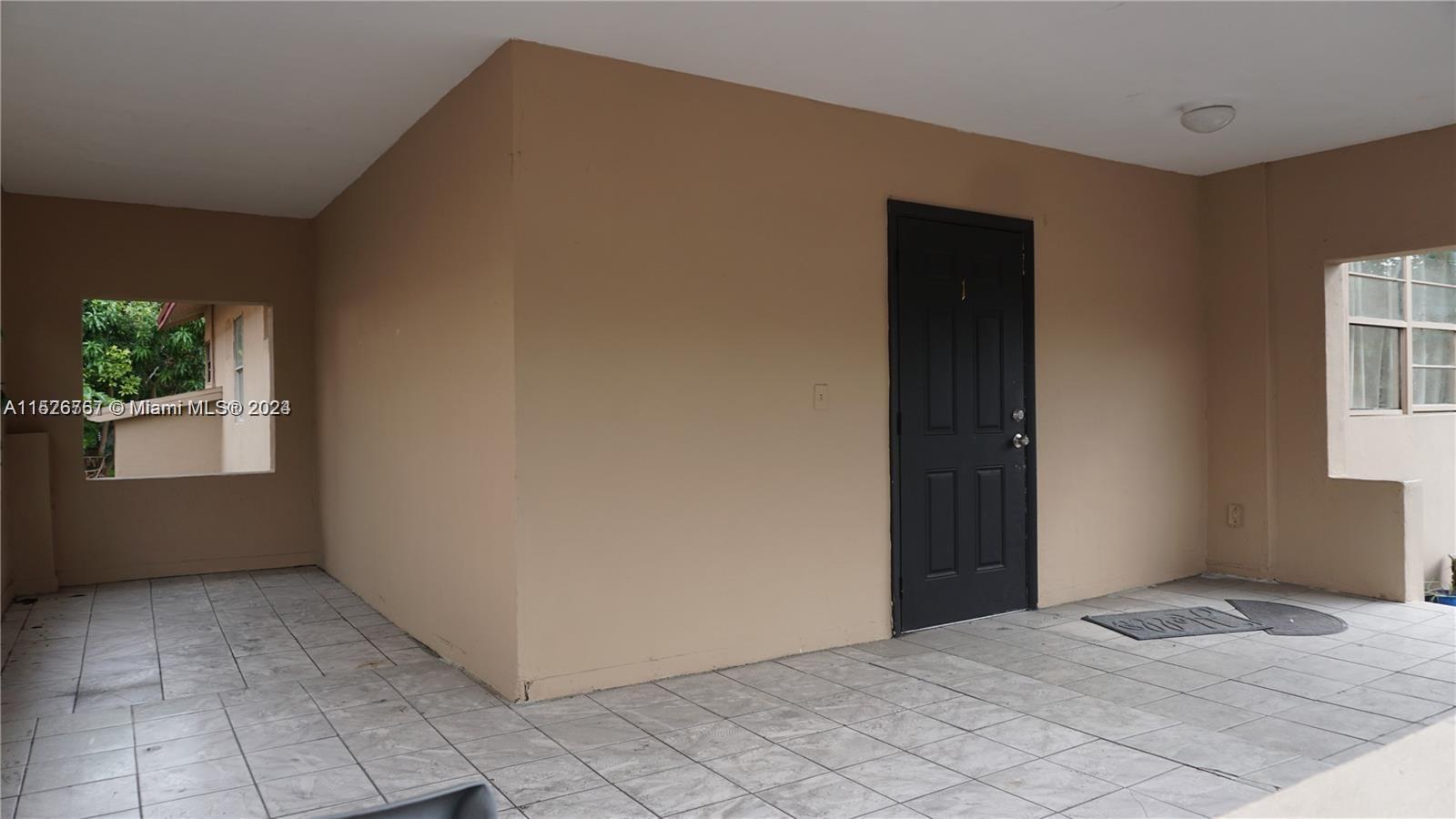 2168 Northwest 28th Street, Unit 1 Miami, FL 33142 - Photo 12 of 13 a view of bedroom and window