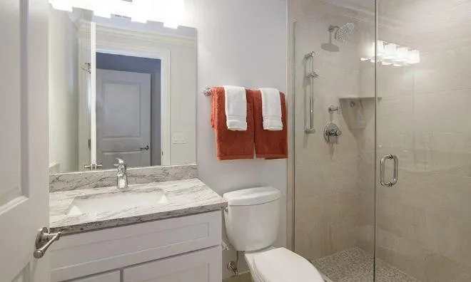 1050 West Monroe Street, Unit 401 Chicago, IL 60607 - Photo 14 of 17 a bathroom with a granite countertop sink toilet and shower