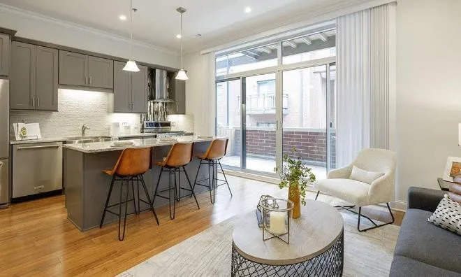 1050 West Monroe Street, Unit 401 Chicago, IL 60607 - Photo 2 of 17 a living room with fireplace furniture and a large window