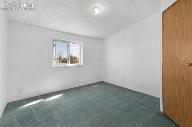 33510 Fossinger Road Yoder, CO 80864 - Photo 24 of 50 One of two secondary bedrooms