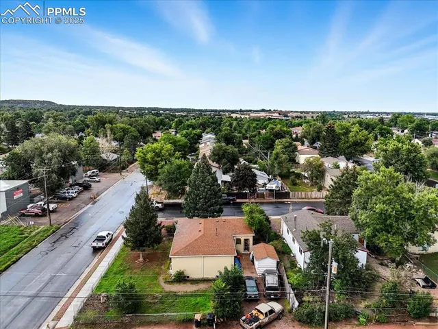 a view of backyard with a patio