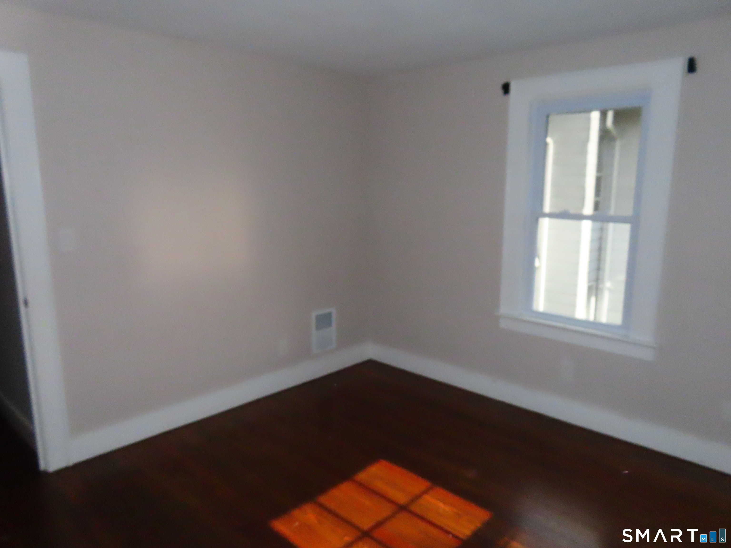 38 Winter Street Ansonia, CT 06401 - Photo 2 of 13 an empty room with a window