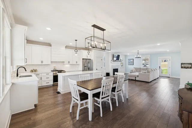 a view of kitchen dining table and wooden floor