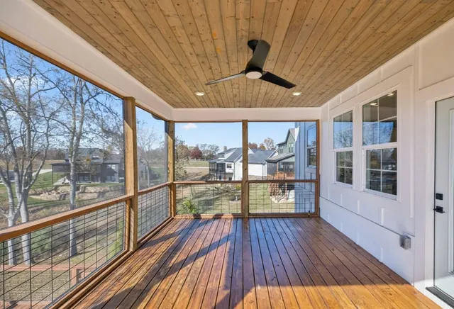 a view of a balcony with wooden floor