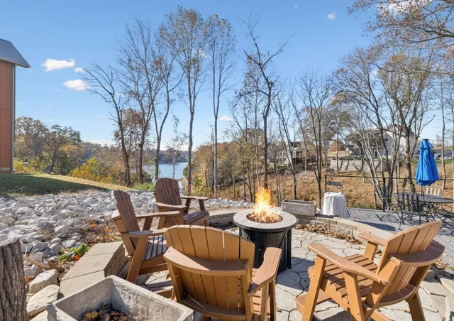 a view of a patio with iron fence
