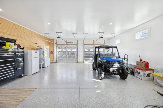 a living room with lots of furniture and a chandelier