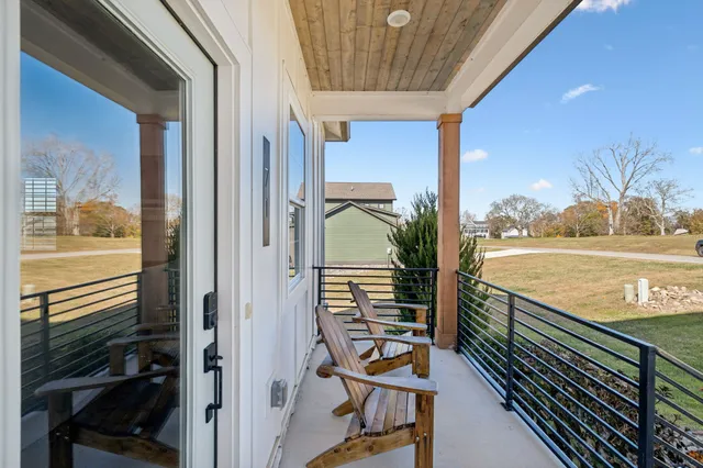 a view of swimming pool from a balcony