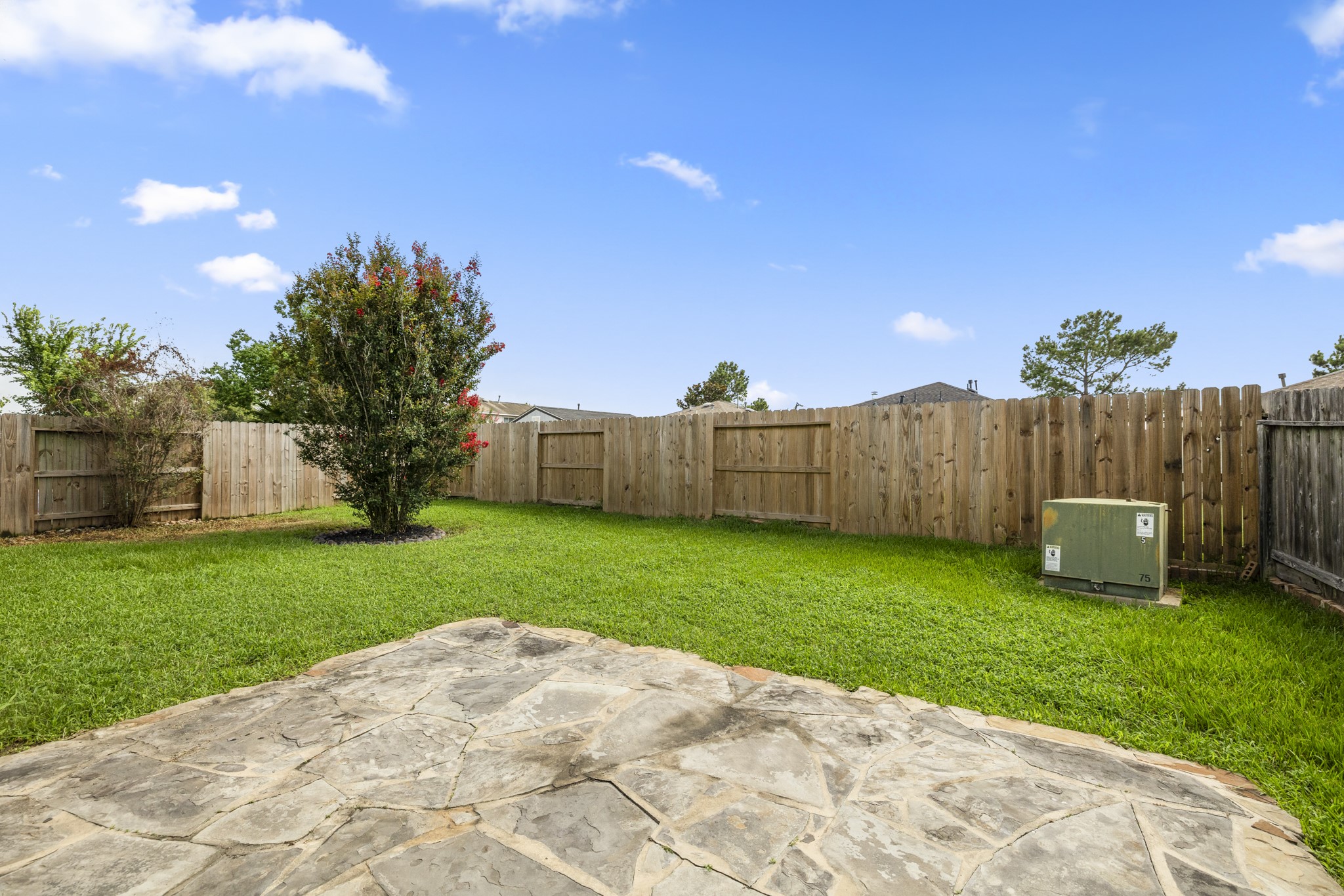 3422 Falcon Trail Court Spring, TX 77373 - Photo 28 of 35 a view of a backyard with a garden and entertaining space