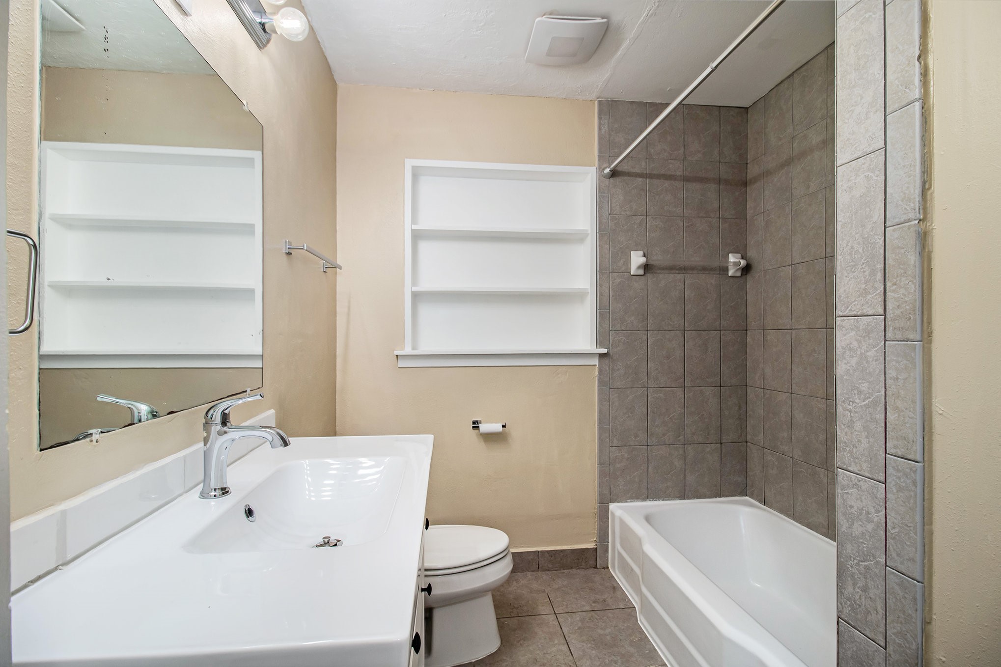 12225 Dumas Street Houston, TX 77034 - Photo 13 of 17 a bathroom with a bathtub shower sink vanity and toilet