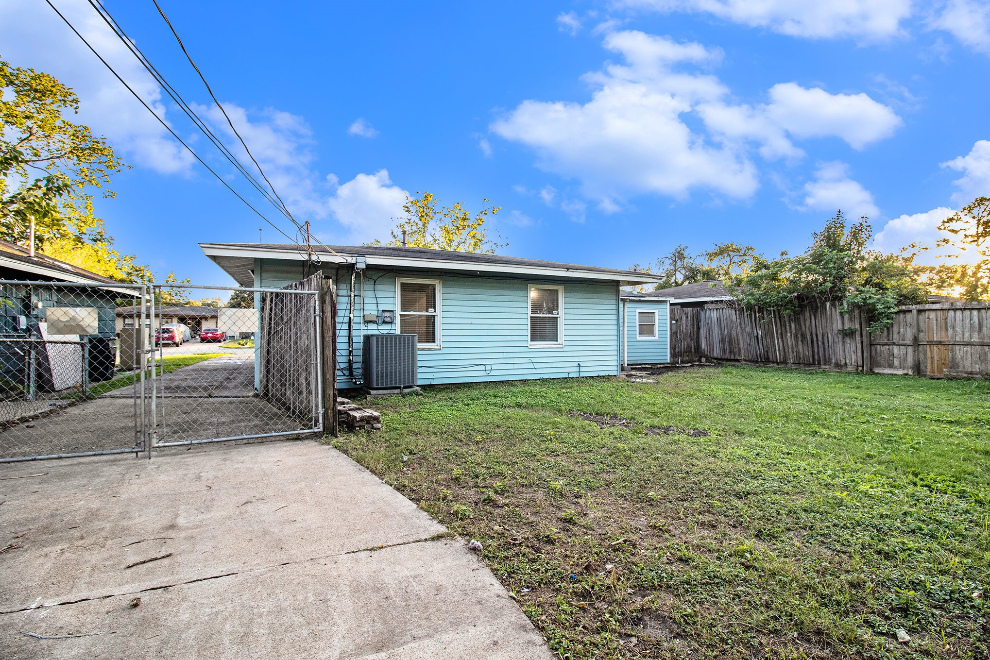 12225 Dumas Street Houston, TX 77034 - Photo 16 of 17 a view of a house with a yard