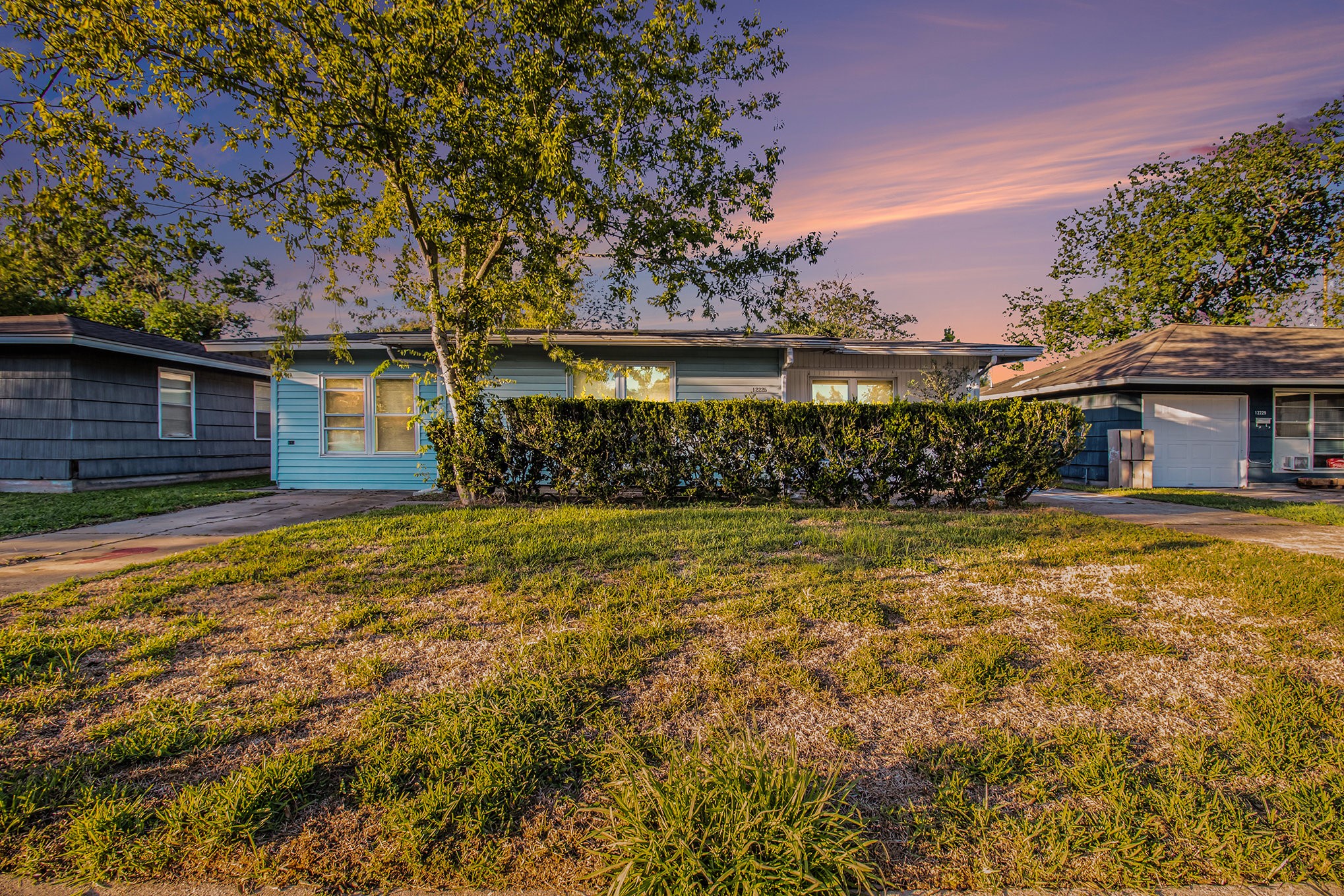 12225 Dumas Street Houston, TX 77034 - Photo 2 of 17 a front view of a house with a yard