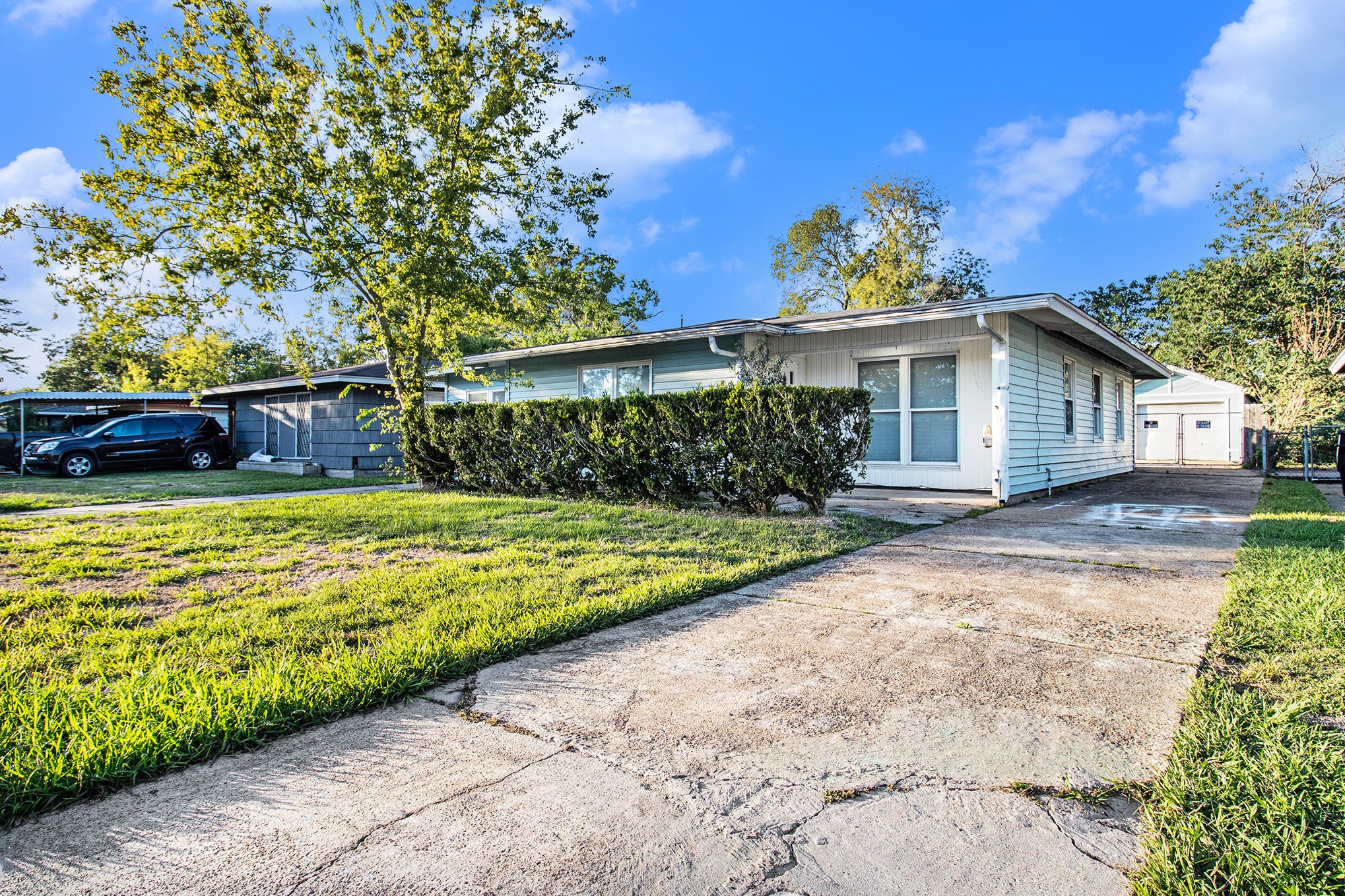 12225 Dumas Street Houston, TX 77034 - Photo 3 of 17 a view of a house with a yard