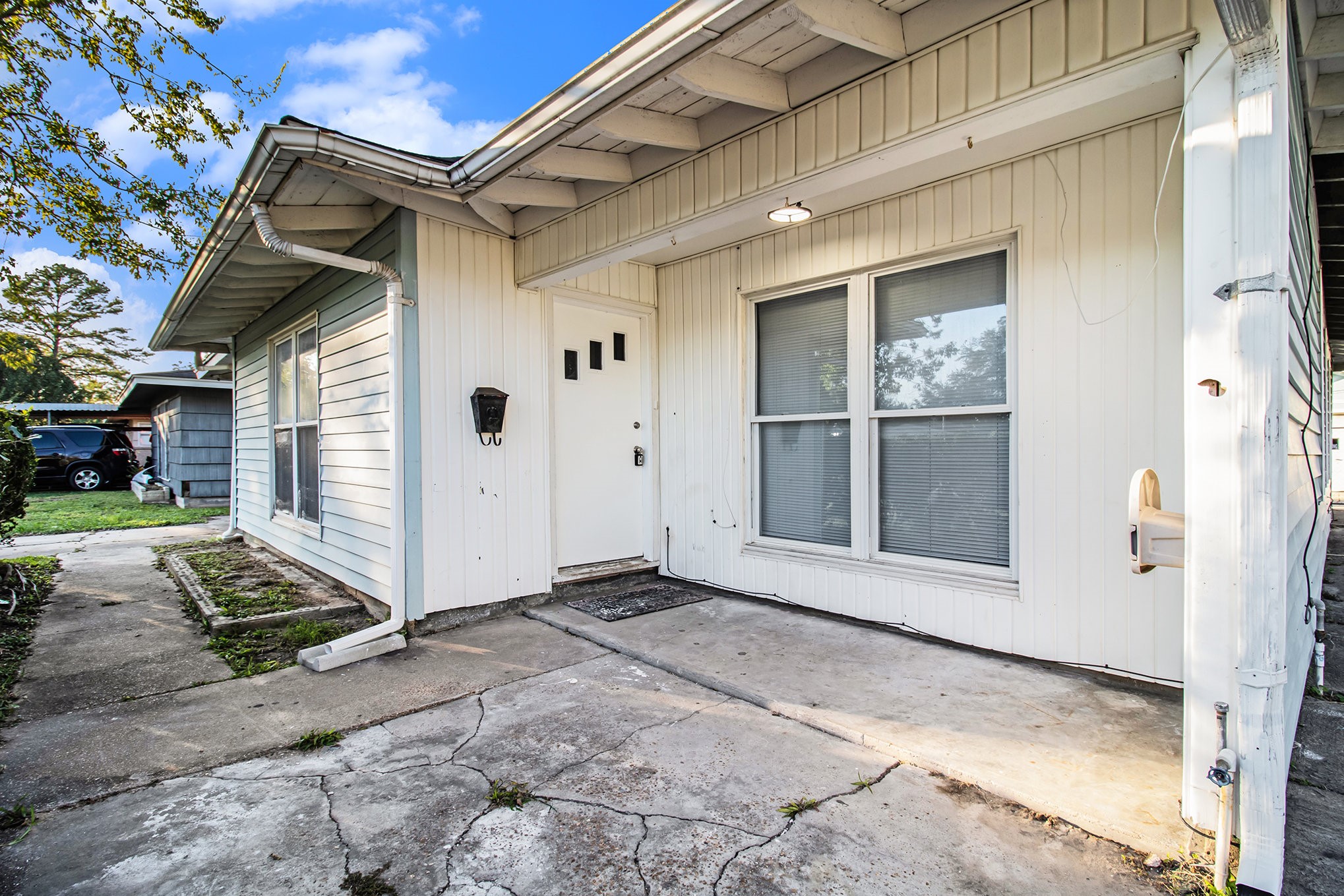 12225 Dumas Street Houston, TX 77034 - Photo 4 of 17 a view of a house with a wooden door