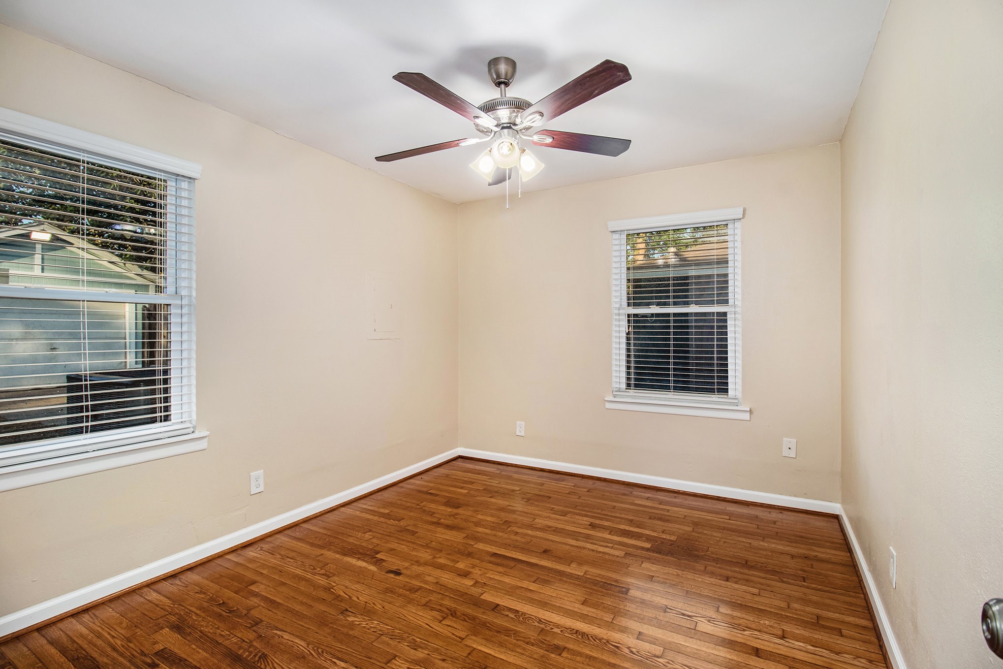 12225 Dumas Street Houston, TX 77034 - Photo 10 of 17 a view of an empty room with wooden floor and a window