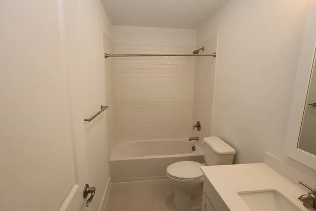 a bathroom with a toilet and shower