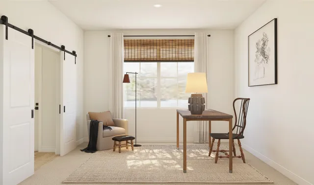 a workspace with furniture and window