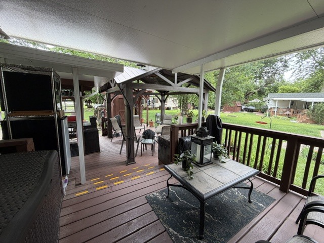 2795 East 28th Road Marseilles, IL 61341 - Photo 51 of 91 a view of a patio with table and chairs floor to ceiling window with wooden floor