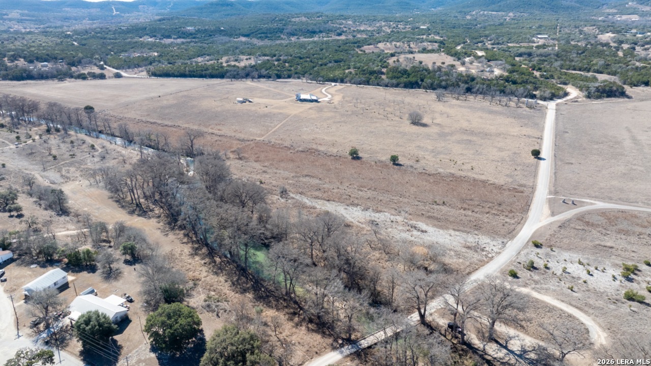 115 Moffett Road Medina, TX 78055 - Photo 16 of 26 a view of a dry yard with wooden fence