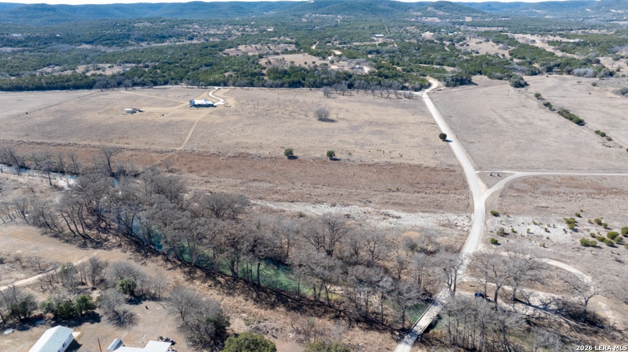 115 Moffett Road Medina, TX 78055 - Photo 17 of 26 a view of a dry yard with wooden fence