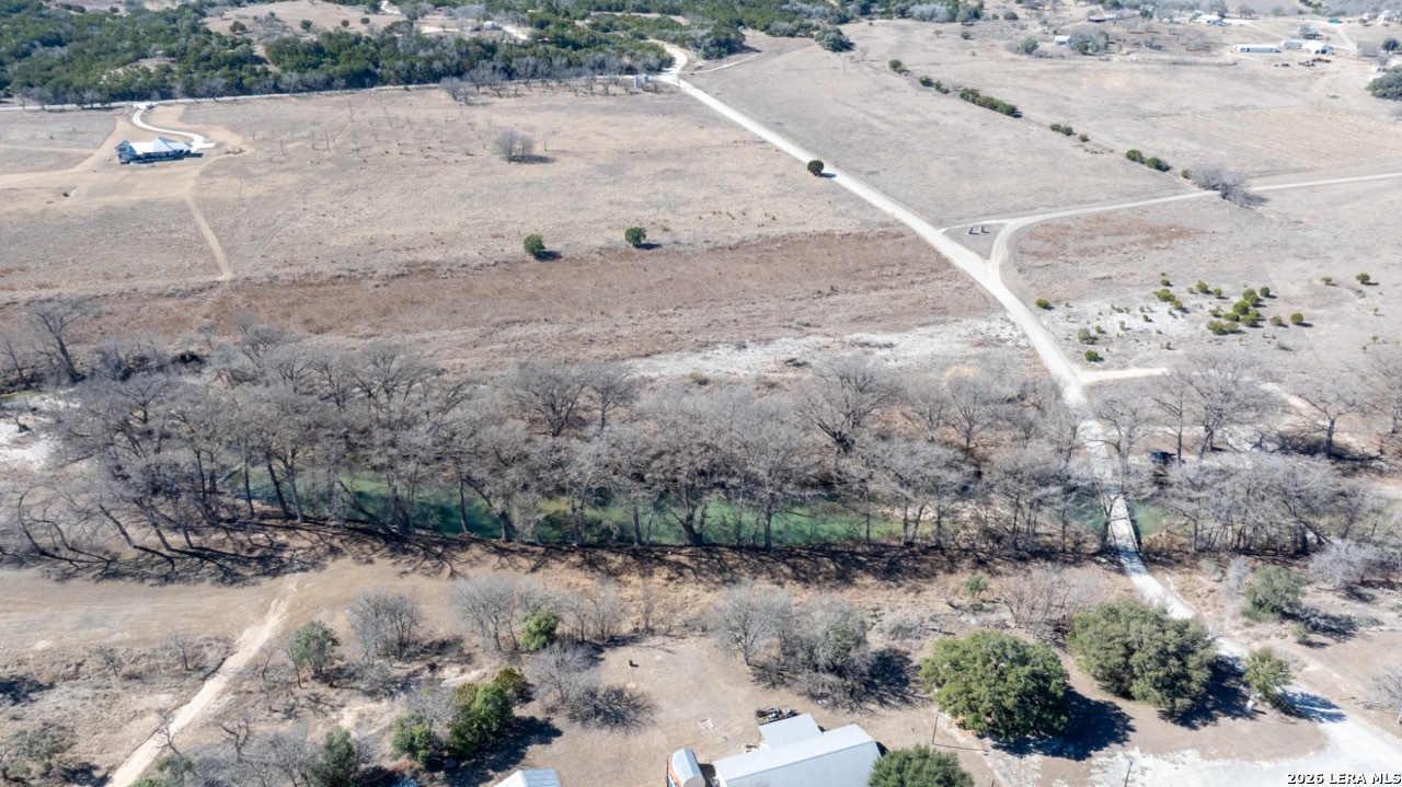 115 Moffett Road Medina, TX 78055 - Photo 21 of 26 a view of a dry yard with trees