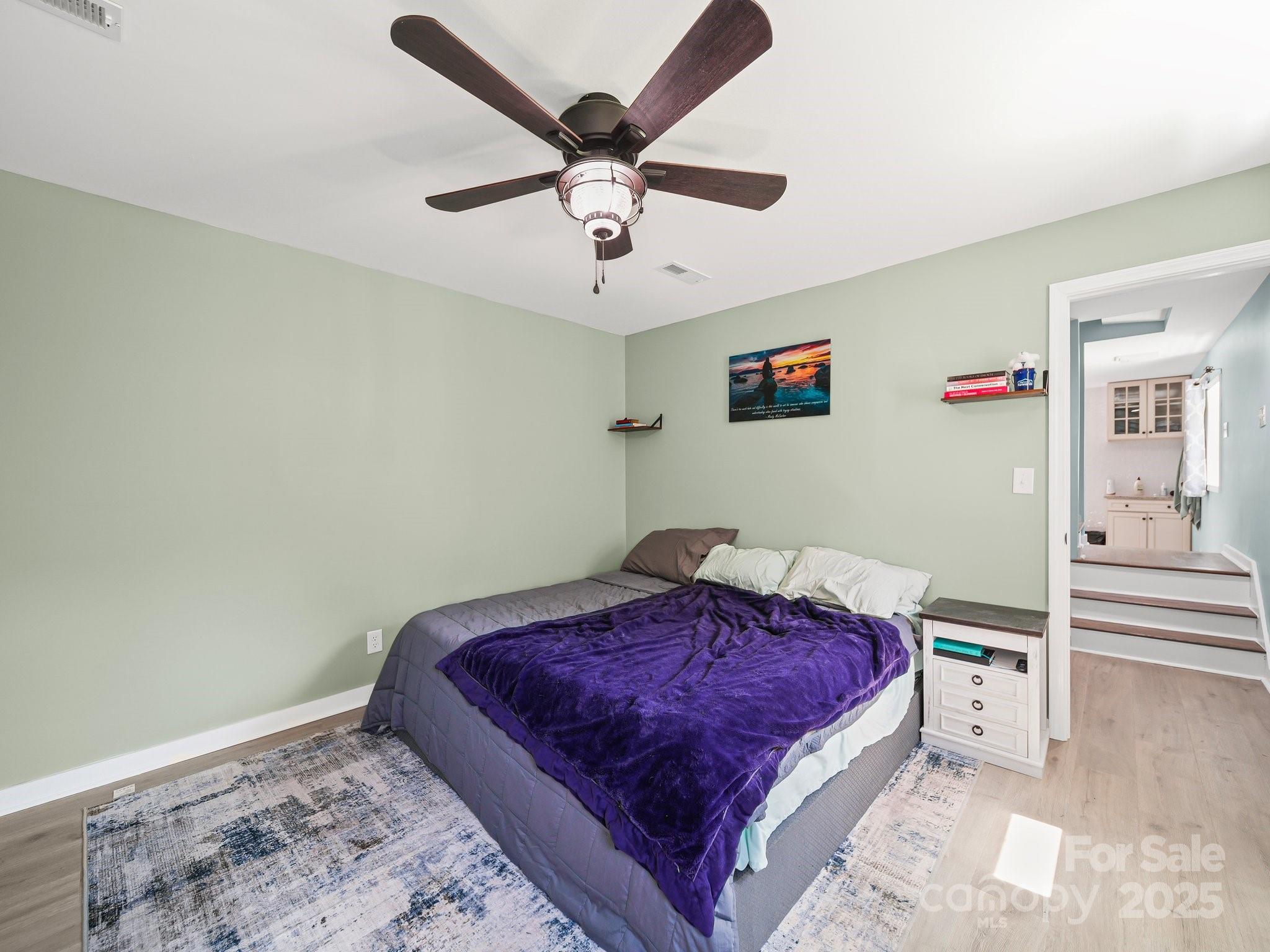4615 Lockhart Road Sharon, SC 29742 - Photo 11 of 18 a bedroom with a bed and a chandelier