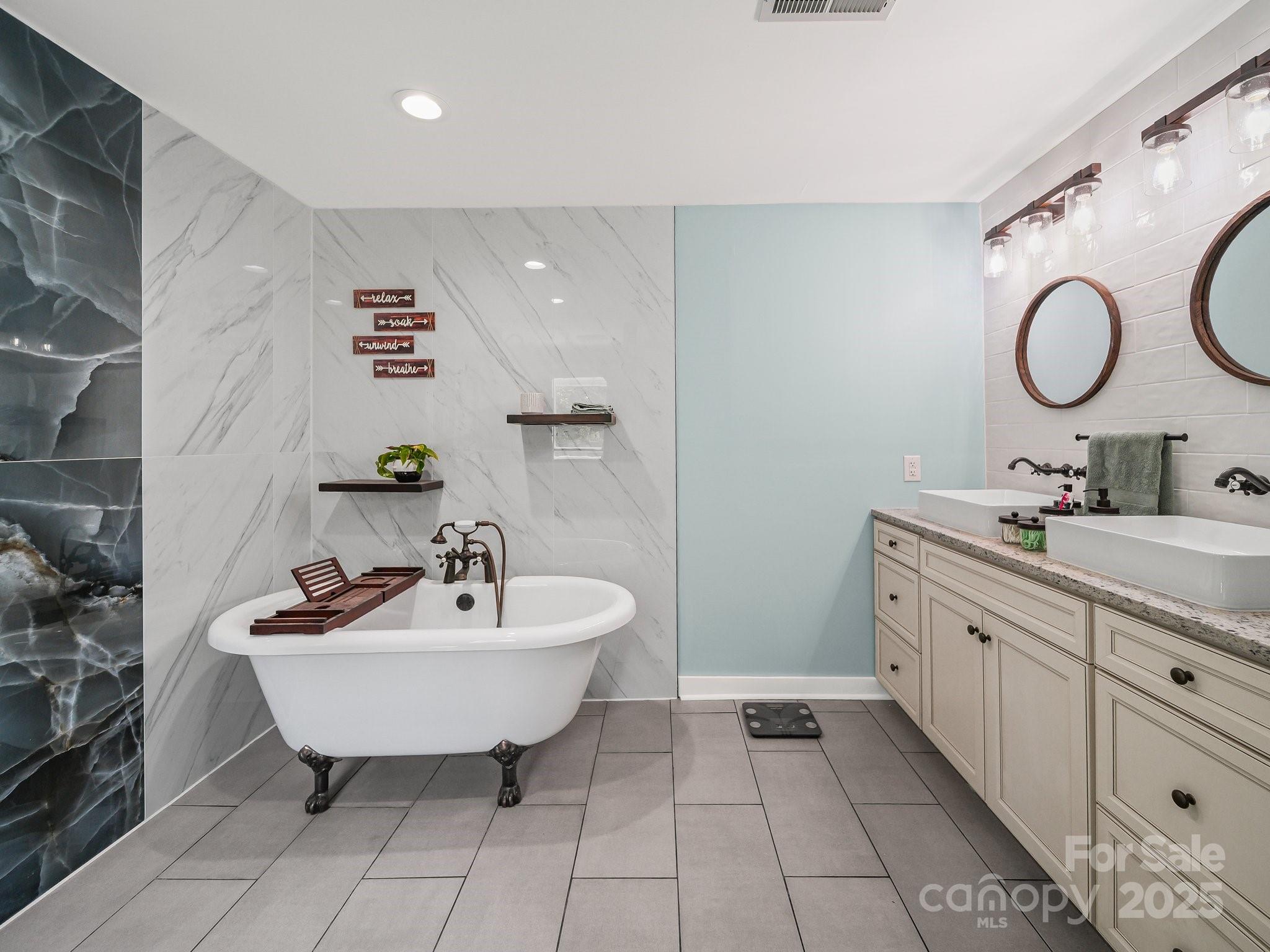 4615 Lockhart Road Sharon, SC 29742 - Photo 12 of 18 a spacious bathroom with a double vanity sink and a mirror