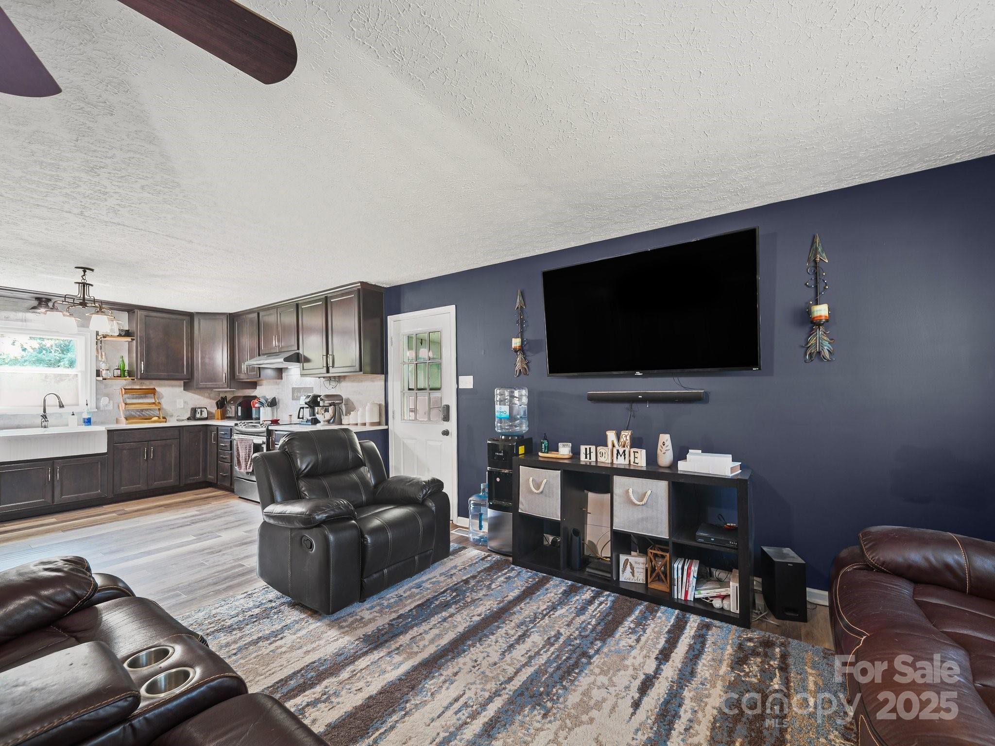 4615 Lockhart Road Sharon, SC 29742 - Photo 5 of 18 a living room with furniture and a flat screen tv