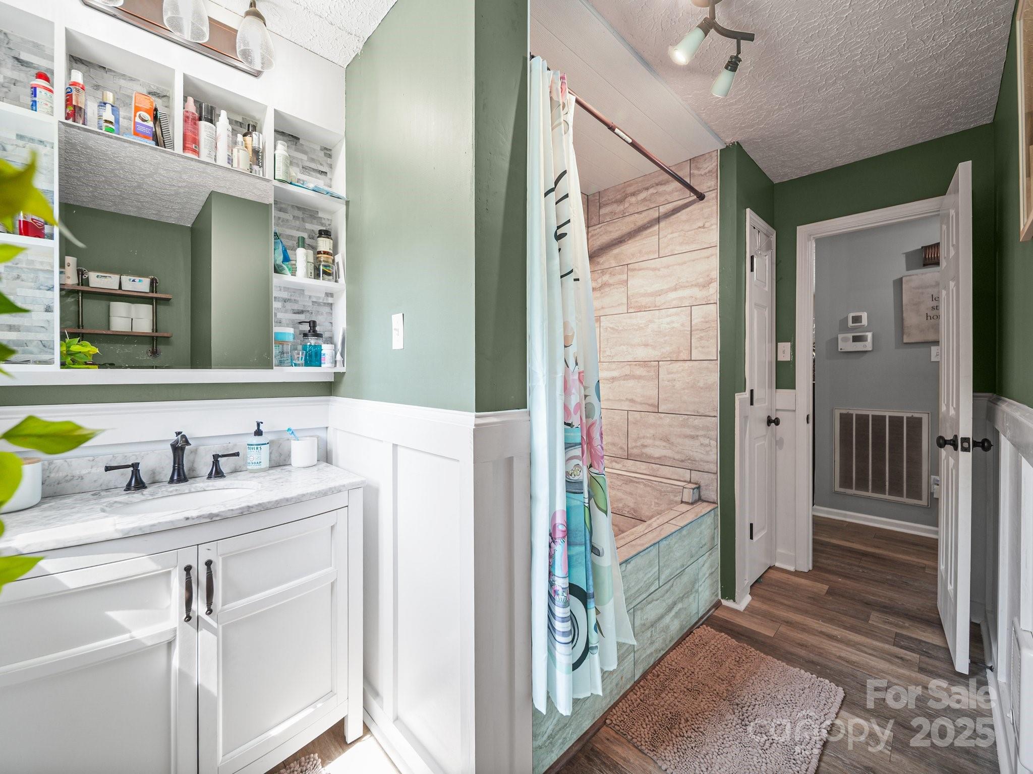 4615 Lockhart Road Sharon, SC 29742 - Photo 7 of 18 a bathroom with a sink a mirror and a shower