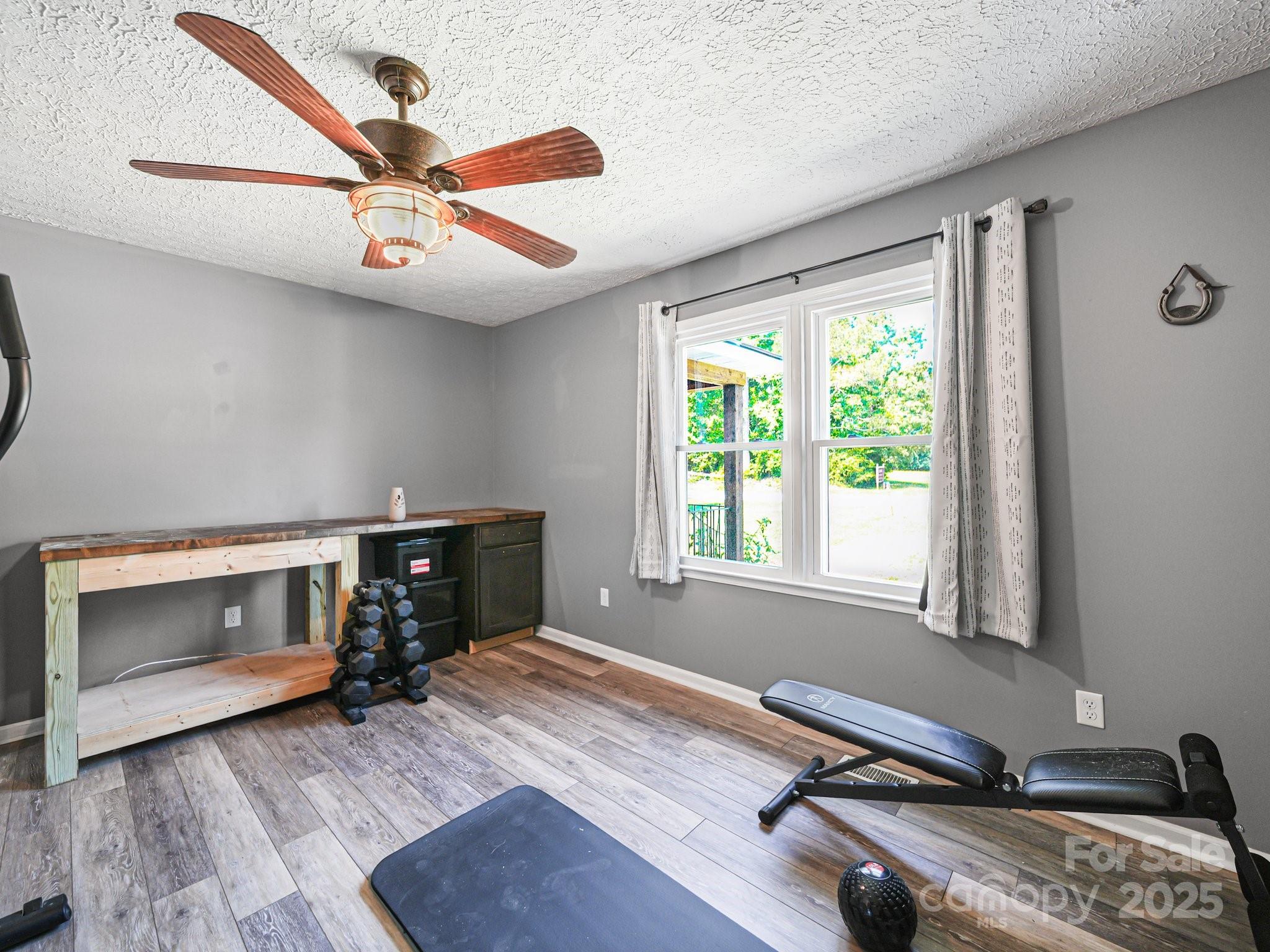 4615 Lockhart Road Sharon, SC 29742 - Photo 8 of 18 a room with gym equipment and a window