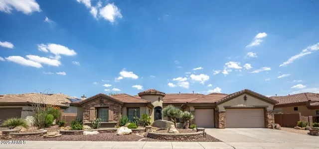 a front view of a house with yard porch and outdoor seating