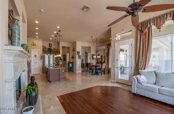 a living room with furniture and a fireplace