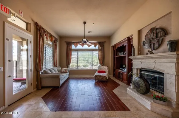 a living room with furniture and a fireplace