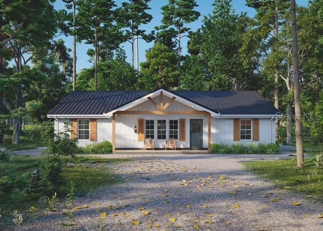 354 Hoot Owl Road Satsuma, FL 32189 - Photo 1 of 20 a front view of a house with a garden