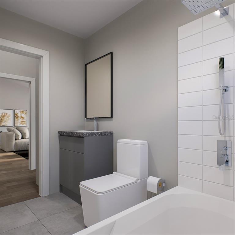 354 Hoot Owl Road Satsuma, FL 32189 - Photo 11 of 20 a bathroom with a toilet sink and mirror