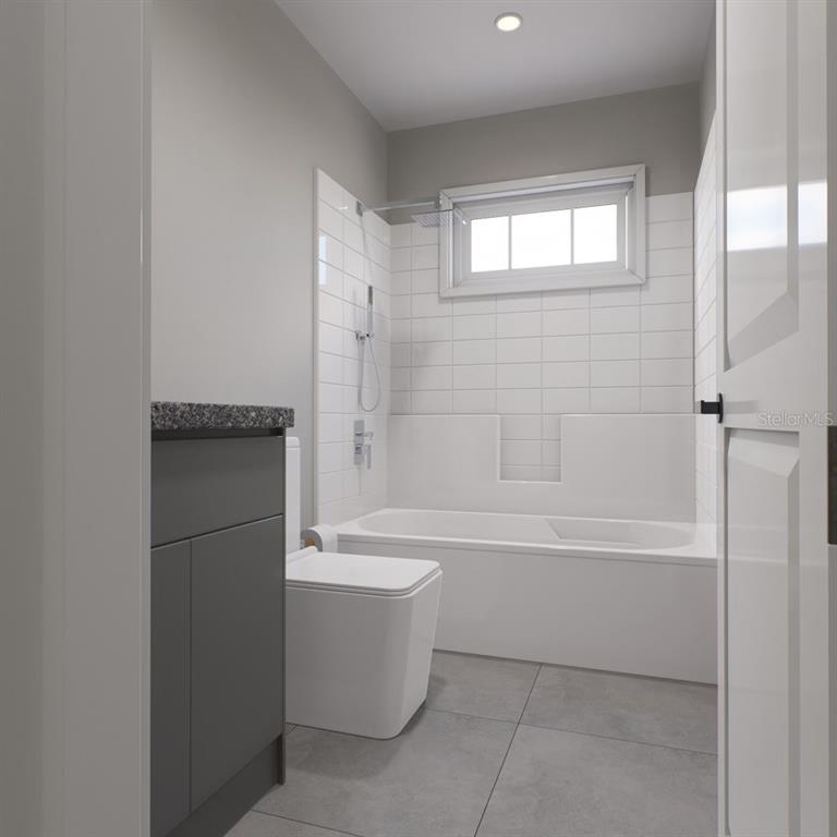 354 Hoot Owl Road Satsuma, FL 32189 - Photo 12 of 20 a bathroom with a bathtub and a shower