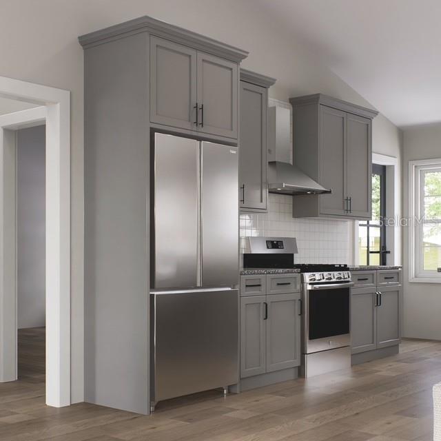 354 Hoot Owl Road Satsuma, FL 32189 - Photo 3 of 20 a kitchen with stainless steel appliances granite countertop a refrigerator and a stove top oven