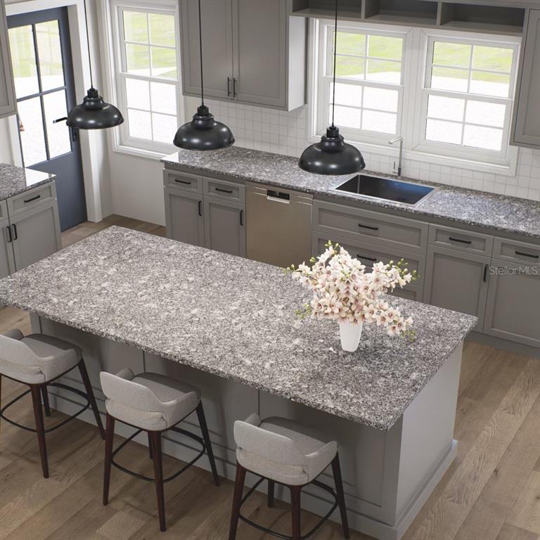 354 Hoot Owl Road Satsuma, FL 32189 - Photo 7 of 20 a kitchen with granite countertop sink table and chairs