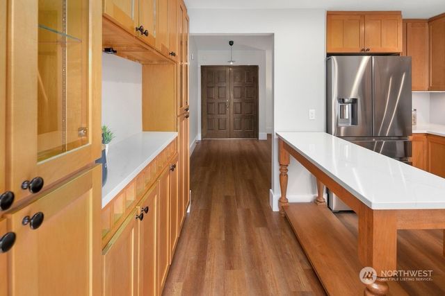 a view of balcony with furniture and wooden floor