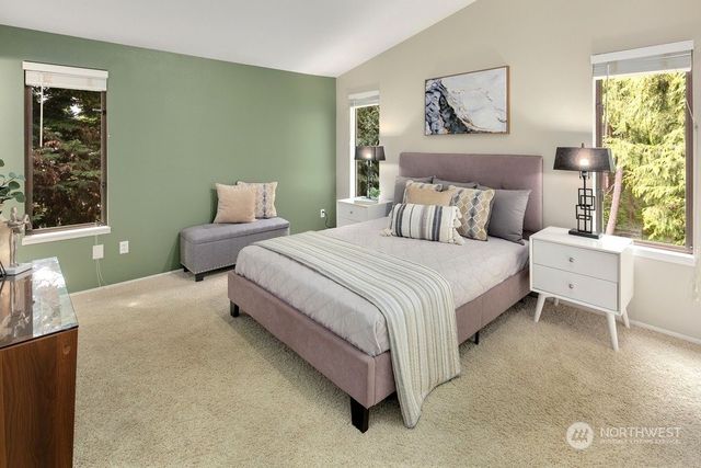 a bedroom with a bed and window