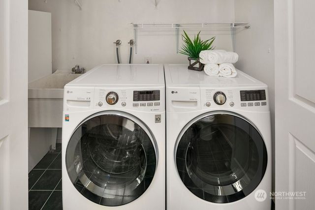 a view of washer and dryer in a utility room