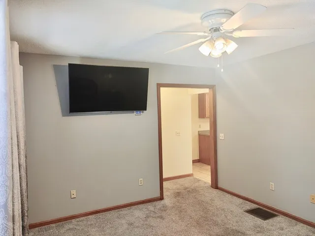 a view of a livingroom with a flat screen tv